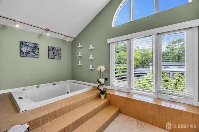 10 Margie Rd, East Brunswick, NJ 08816 - bathroom with track lighting, a tub with jets, tile patterned floors, and plenty of natural light