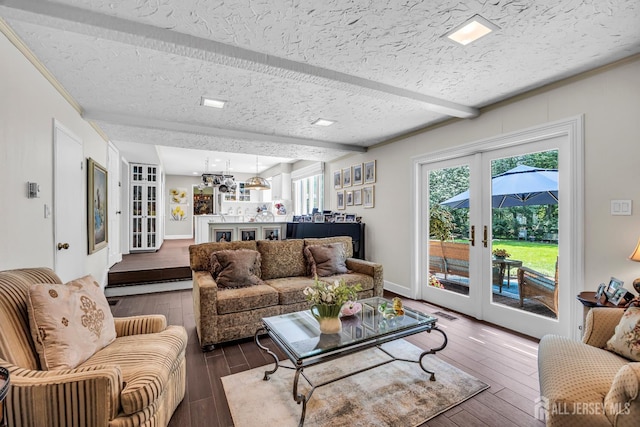 10 Margie Rd, East Brunswick, NJ 08816 - living area with french doors, wood finished floors, a textured ceiling, beamed ceiling, and baseboards