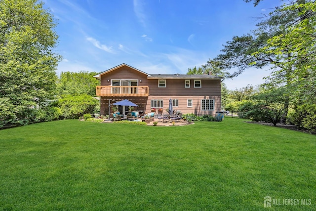 10 Margie Rd, East Brunswick, NJ 08816 - back of property featuring a patio, a yard, and a balcony