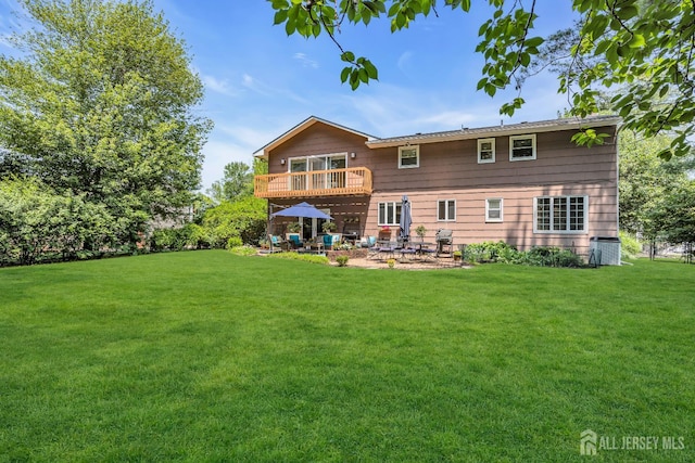 10 Margie Rd, East Brunswick, NJ 08816 - rear view of property featuring a patio, a yard, and central air condition unit