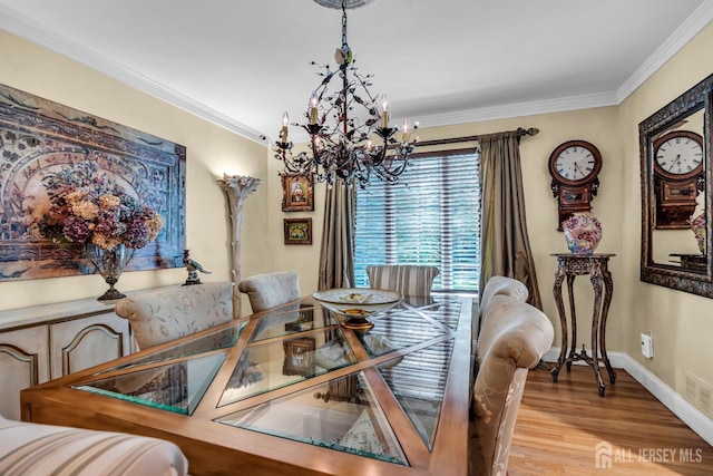 10 Margie Rd, East Brunswick, NJ 08816 - dining space featuring a chandelier, light wood-type flooring, ornamental molding, and baseboards