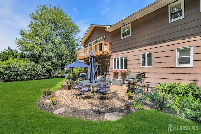 10 Margie Rd, East Brunswick, NJ 08816 - rear view of property with a balcony, a lawn, and a patio