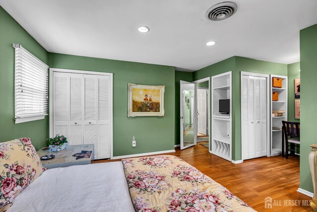 10 Margie Rd, East Brunswick, NJ 08816 - bedroom with multiple closets, wood finished floors, baseboards, and recessed lighting