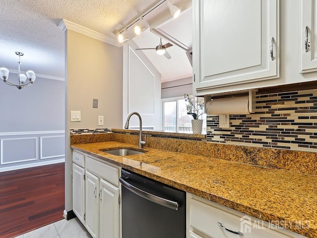 1010 Aspen Dr, Plainsboro, NJ 08536 - kitchen with dishwashing machine, a sink, crown molding, ceiling fan, and dark stone counters