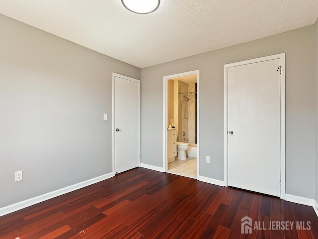 1010 Aspen Dr, Plainsboro, NJ 08536 - unfurnished bedroom with wood finished floors, baseboards, and ensuite bath