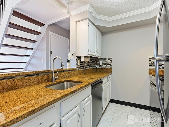 1010 Aspen Dr, Plainsboro, NJ 08536 - kitchen with stainless steel appliances, a sink, light marble finish flooring, dark stone counters, and white cabinetry