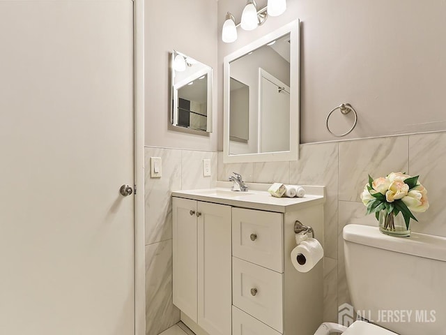 1010 Aspen Dr, Plainsboro, NJ 08536 - half bathroom featuring vanity, tile walls, and toilet