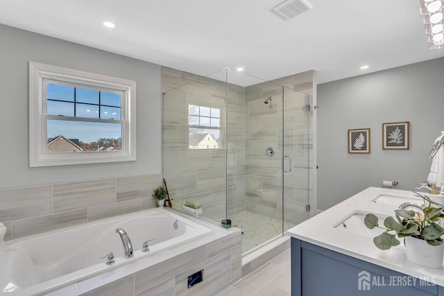 28 Kenmore Rd, Edison, NJ 08817 - bathroom featuring a garden tub, a stall shower, double vanity, and recessed lighting