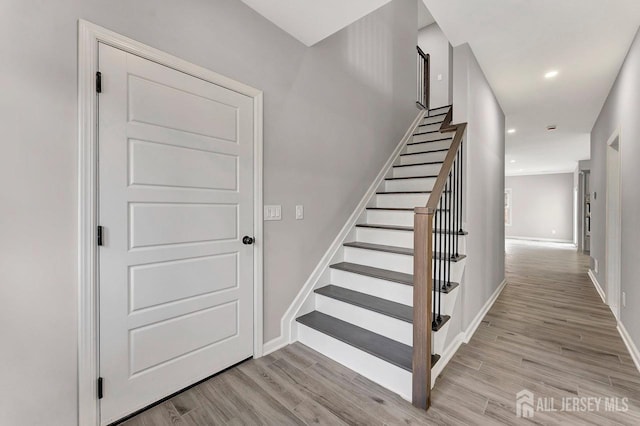 28 Kenmore Rd, Edison, NJ 08817 - stairs featuring wood finished floors, baseboards, and recessed lighting