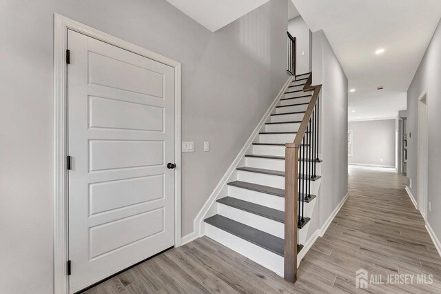28 Kenmore Rd, Edison, NJ 08817 - stairway featuring wood finished floors and recessed lighting