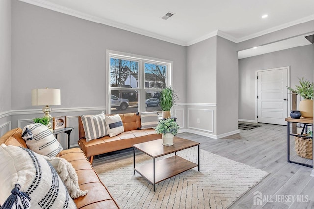 28 Kenmore Rd, Edison, NJ 08817 - living area featuring light wood finished floors, ornamental molding, recessed lighting, and wainscoting
