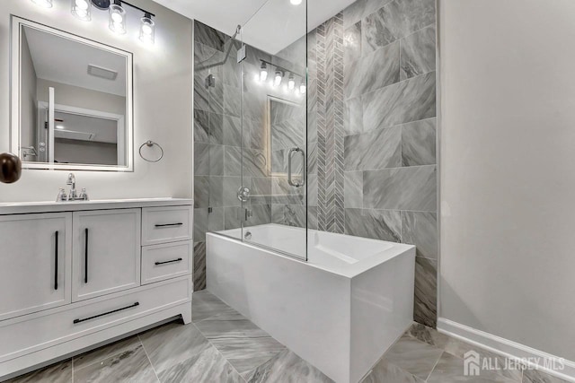 28 Kenmore Rd, Edison, NJ 08817 - full bathroom with marble look tiles, vanity, and  shower combination