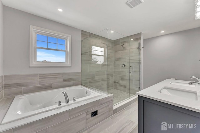 28 Kenmore Rd, Edison, NJ 08817 - bathroom with a garden tub, a stall shower, recessed lighting, and double vanity