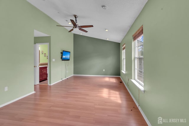 20 Sassafras Ct, North Brunswick, NJ 08902 - unfurnished room with vaulted ceiling, ceiling fan, light wood-type flooring, and baseboards