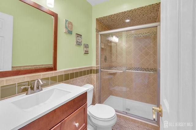 20 Sassafras Ct, North Brunswick, NJ 08902 - full bath featuring toilet, vanity, a shower stall, tile walls, and wainscoting