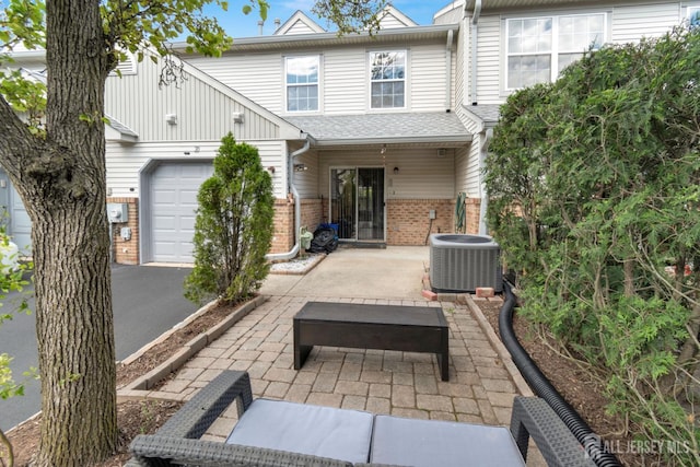 20 Sassafras Ct, North Brunswick, NJ 08902 - rear view of property featuring central AC, brick siding, and a patio area