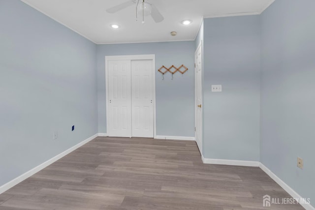 20 Sassafras Ct, North Brunswick, NJ 08902 - unfurnished bedroom with baseboards, a closet, wood finished floors, crown molding, and recessed lighting