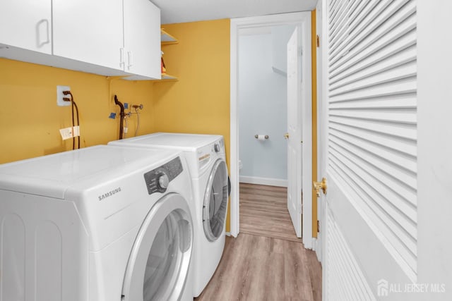 20 Sassafras Ct, North Brunswick, NJ 08902 - washroom featuring independent washer and dryer, light wood-style flooring, cabinet space, and baseboards
