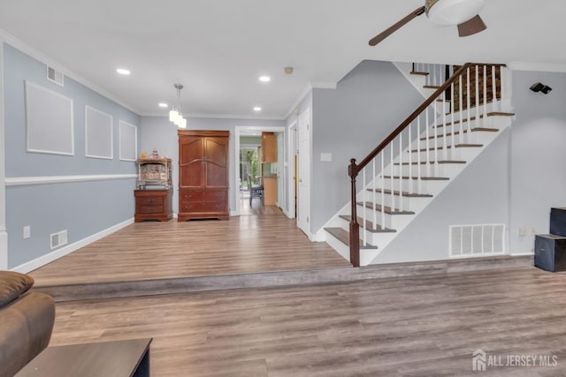20 Sassafras Ct, North Brunswick, NJ 08902 - foyer with ornamental molding, stairs, recessed lighting, a ceiling fan, and baseboards