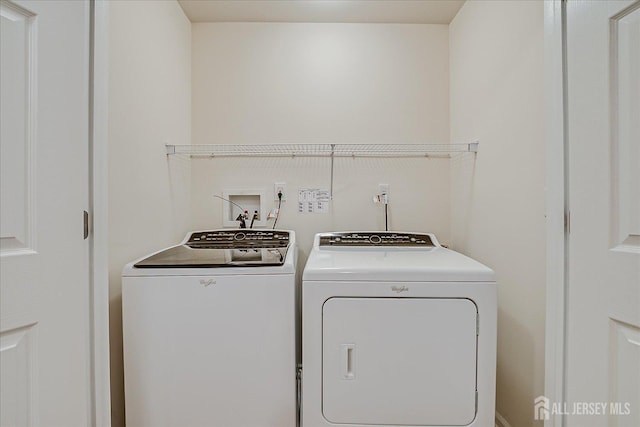 clothes washing area with independent washer and dryer