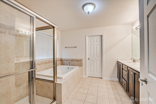 full bathroom with tile patterned flooring, a shower stall, a bath, and double vanity