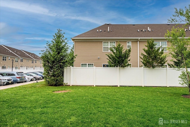 view of home's exterior featuring uncovered parking