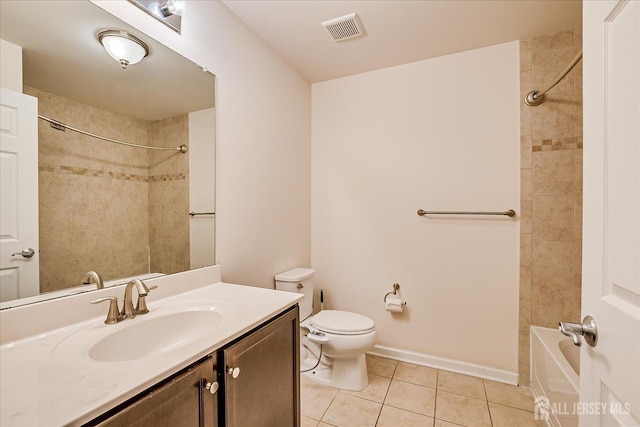bathroom with tile patterned floors, toilet, vanity, and bathing tub / shower combination