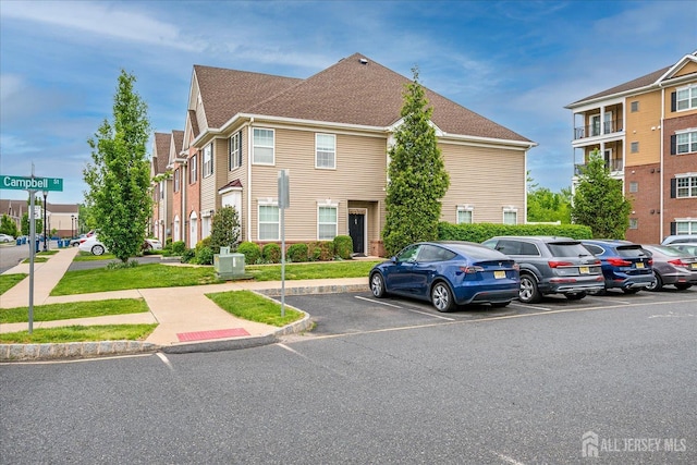 view of front of house with uncovered parking