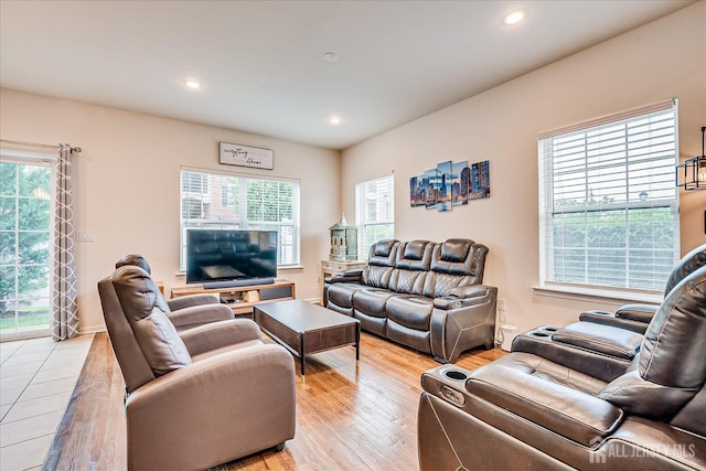 living room featuring healthy amount of natural light, light wood-style flooring, and recessed lighting