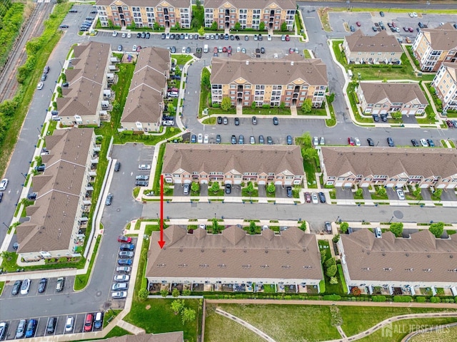 aerial view of property's location with nearby suburban area