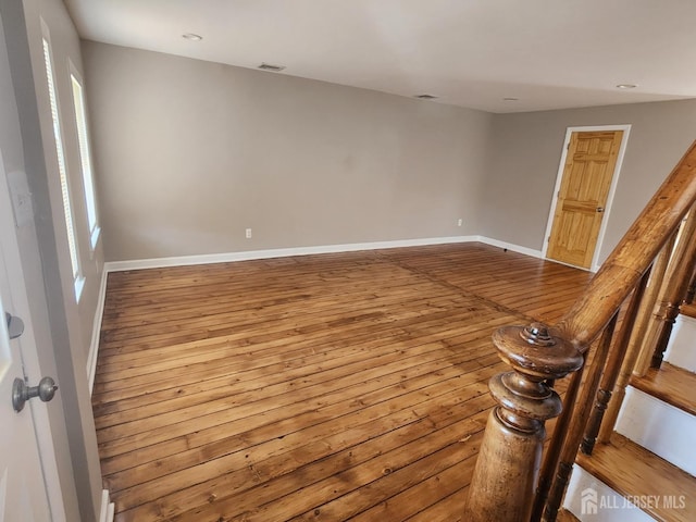 53 Suydam St, New Brunswick, NJ 08901 - unfurnished room featuring wood-type flooring, baseboards, plenty of natural light, and recessed lighting