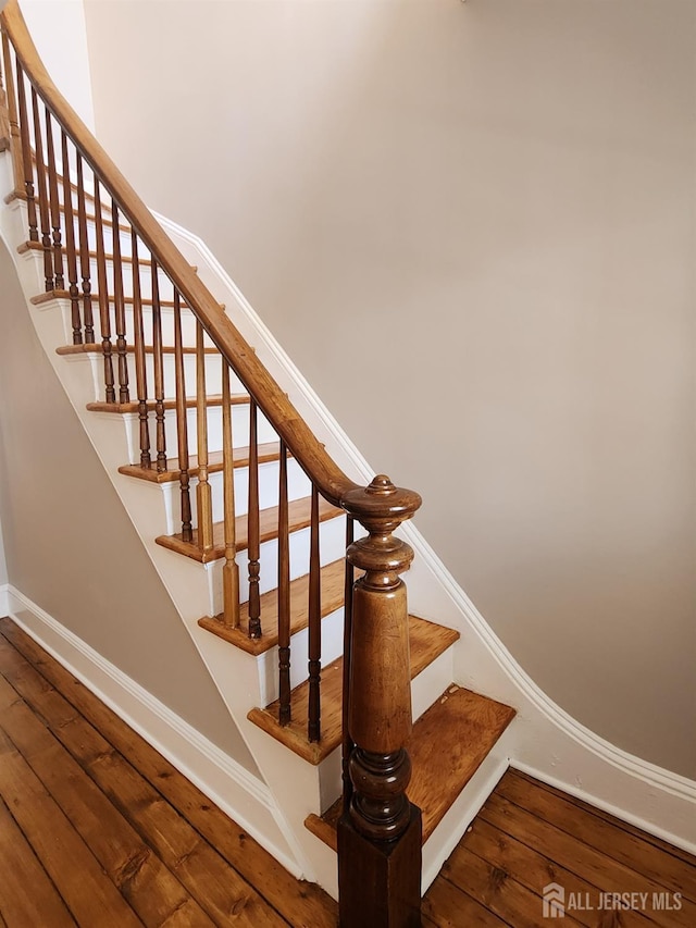 53 Suydam St, New Brunswick, NJ 08901 - staircase with hardwood / wood-style floors and baseboards