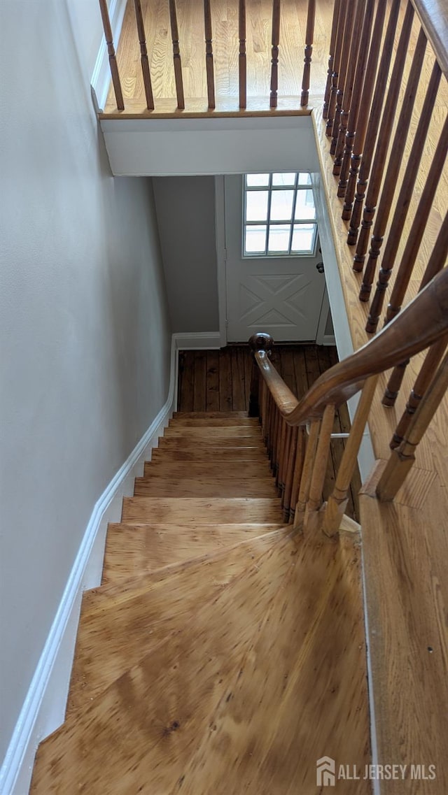 53 Suydam St, New Brunswick, NJ 08901 - staircase featuring hardwood / wood-style flooring and baseboards