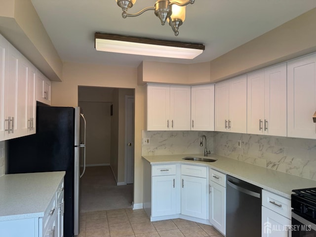 112 Biscayne Ct Unit 8, West Windsor, NJ 08540 - kitchen featuring stainless steel appliances, white cabinetry, a chandelier, light tile patterned floors, and light countertops