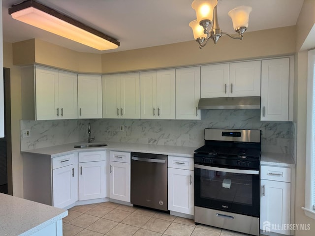 112 Biscayne Ct Unit 8, West Windsor, NJ 08540 - kitchen featuring appliances with stainless steel finishes, under cabinet range hood, light countertops, a chandelier, and white cabinets