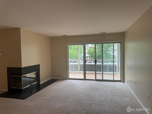 112 Biscayne Ct Unit 8, West Windsor, NJ 08540 - unfurnished living room featuring a multi sided fireplace and carpet floors