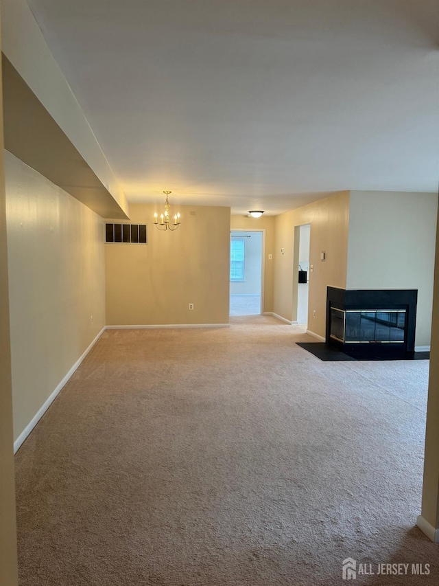 112 Biscayne Ct Unit 8, West Windsor, NJ 08540 - unfurnished living room featuring a chandelier, a fireplace with flush hearth, and carpet flooring