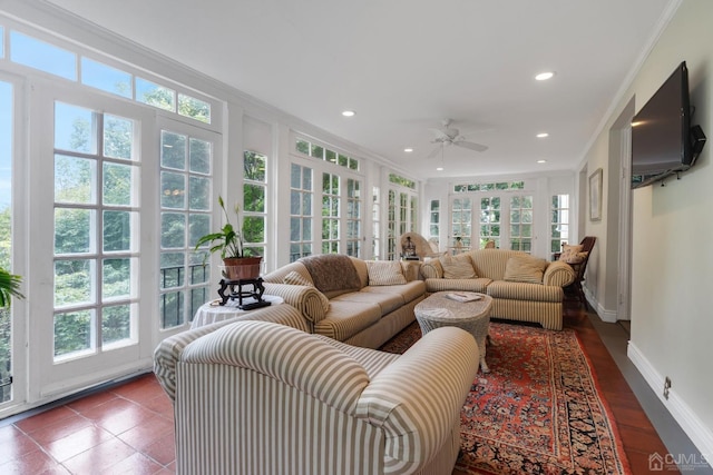 sunroom with plenty of natural light and ceiling fan