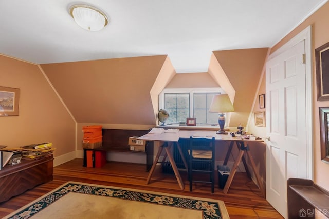 office space with lofted ceiling and dark hardwood / wood-style flooring