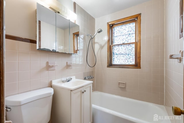 678 Bingle St, Perth Amboy, NJ 08861 - full bath with tile walls, toilet, vanity, and shower / bath combination