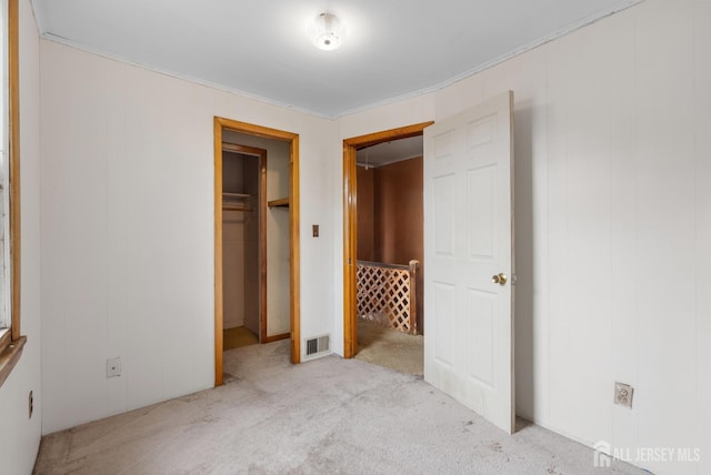 678 Bingle St, Perth Amboy, NJ 08861 - unfurnished bedroom featuring light colored carpet and ornamental molding
