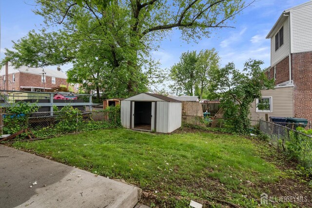 678 Bingle St, Perth Amboy, NJ 08861 - fenced backyard with a storage shed