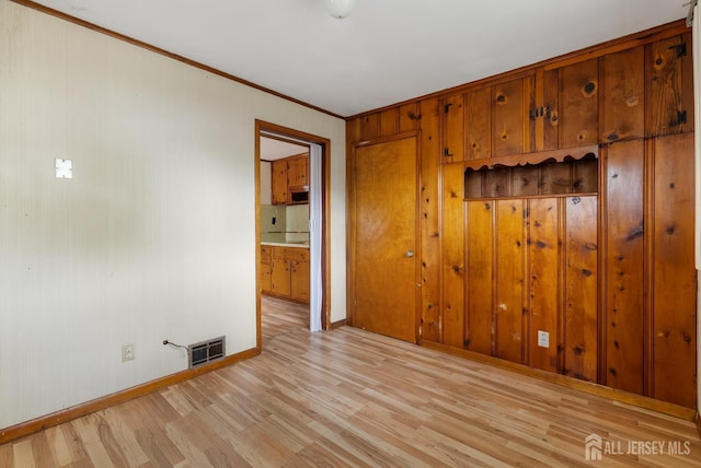 678 Bingle St, Perth Amboy, NJ 08861 - spare room featuring light wood-type flooring, baseboards, and crown molding
