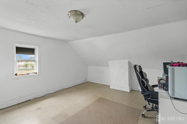 209 New St, New Brunswick, NJ 08901 - unfurnished office with tile patterned floors, a textured ceiling, and lofted ceiling