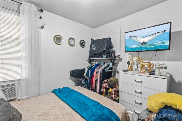 209 New St, New Brunswick, NJ 08901 - bedroom featuring a textured ceiling and cooling unit