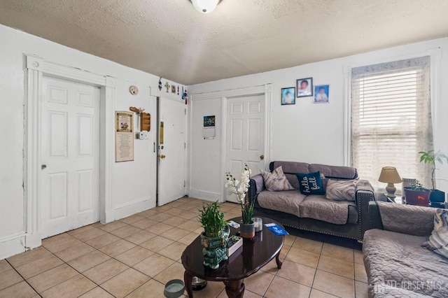 209 New St, New Brunswick, NJ 08901 - living room with light tile patterned flooring and a textured ceiling
