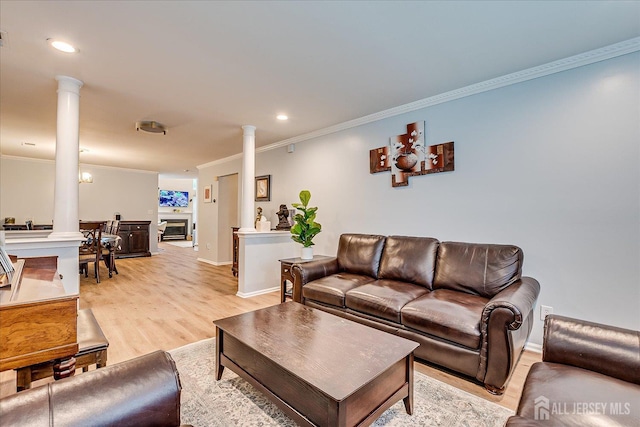 7 Cambridge Ct, East Brunswick, NJ 08816 - living room with ornate columns, ornamental molding, light wood-type flooring, recessed lighting, and a glass covered fireplace
