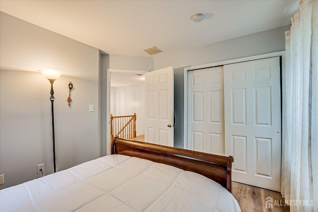 7 Cambridge Ct, East Brunswick, NJ 08816 - bedroom with wood finished floors and a closet