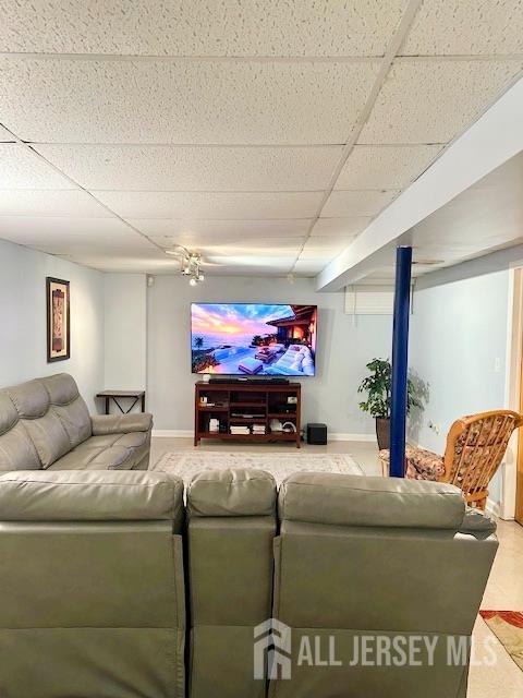 7 Cambridge Ct, East Brunswick, NJ 08816 - living room featuring a paneled ceiling and baseboards