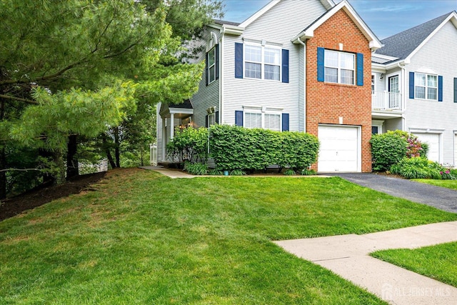 7 Cambridge Ct, East Brunswick, NJ 08816 - view of front of house with brick siding, an attached garage, asphalt driveway, and a front lawn